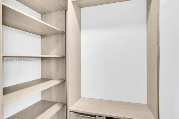 a view of an empty walk in closet