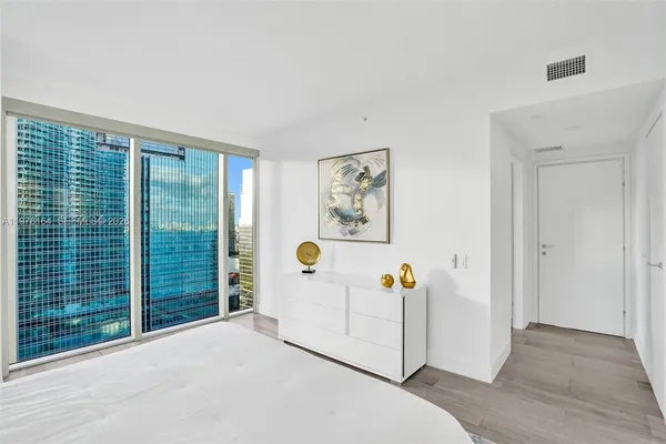 a view of a livingroom with an empty space and a window