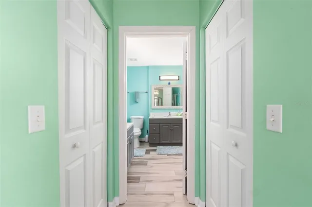 a view of a bathroom from a hallway