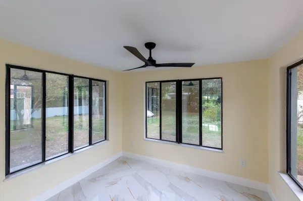 a view of empty room with windows