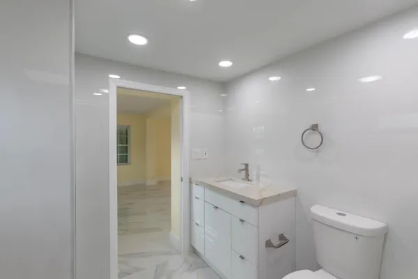 a view of a livingroom with a ceiling fan and window