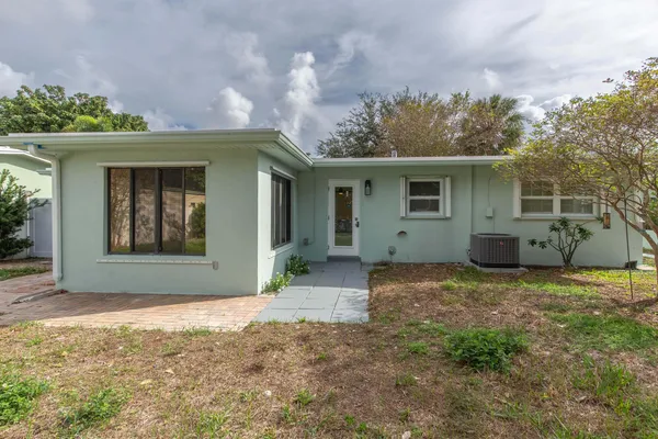 a backyard of a house with lots of green space