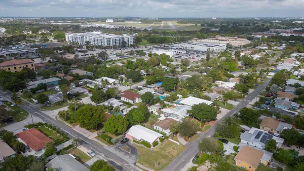 an aerial view of a house with outdoor space and street view
