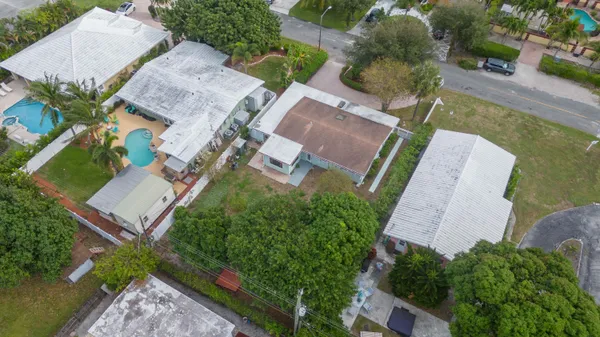 an aerial view of residential houses with outdoor space