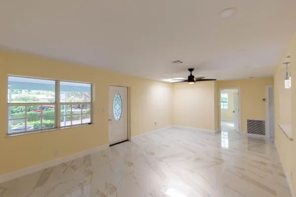 a kitchen with stainless steel appliances granite countertop a refrigerator sink and stove