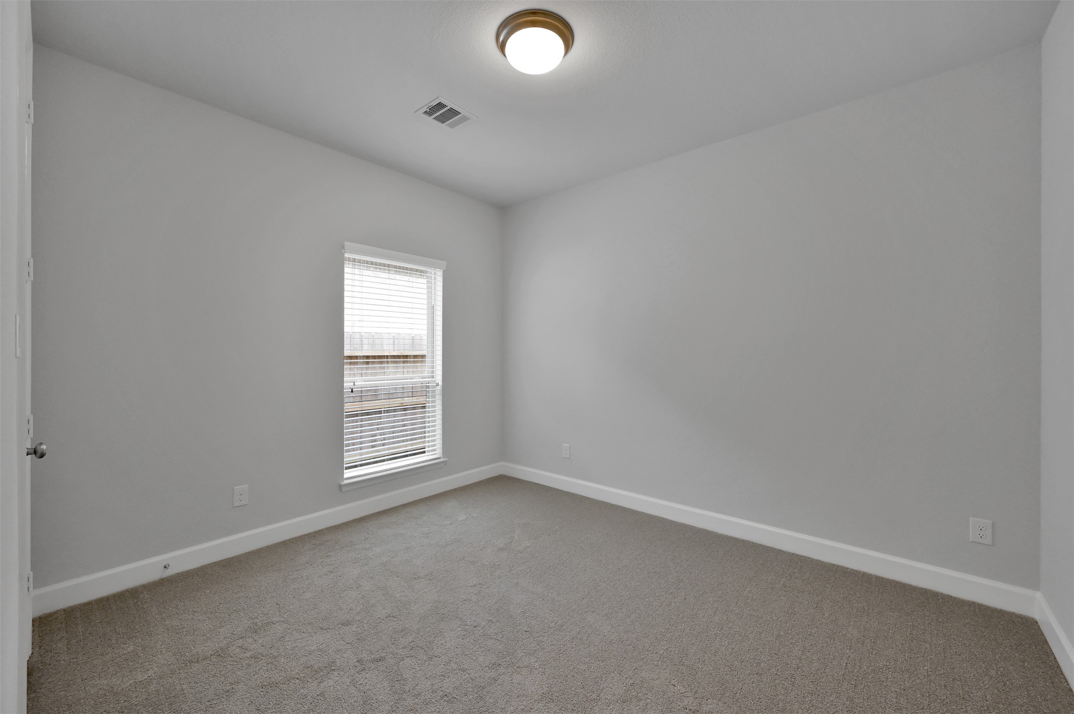 15715 Autumn Sun Conroe, TX 77302 - Photo 18 of 23 an empty room with a window