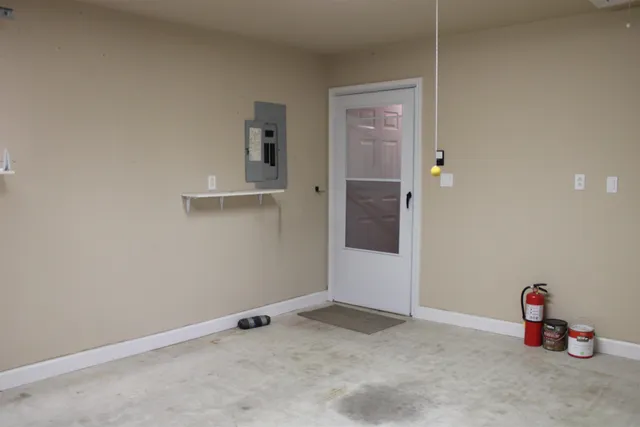 a backyard of a house with plants and trees