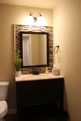 a bathroom with a sink and a toilet