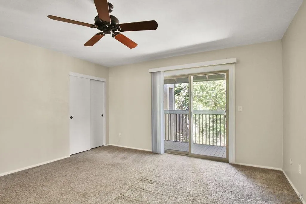 6359 Rancho Mission Road, Unit 7 San Diego, CA 92108 - Photo 14 of 25 a view of empty room with wooden floor
