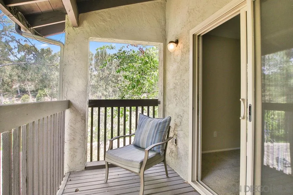 6359 Rancho Mission Road, Unit 7 San Diego, CA 92108 - Photo 15 of 25 a view of a balcony with chair and table