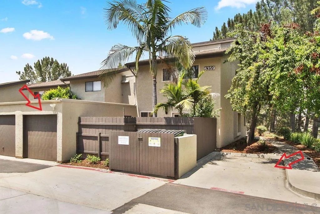 6359 Rancho Mission Road, Unit 7 San Diego, CA 92108 - Photo 2 of 25 a front view of a house with a garden