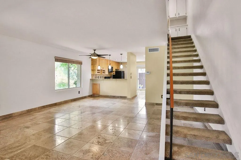 6359 Rancho Mission Road, Unit 7 San Diego, CA 92108 - Photo 3 of 25 a view of a kitchen with furniture and staircase