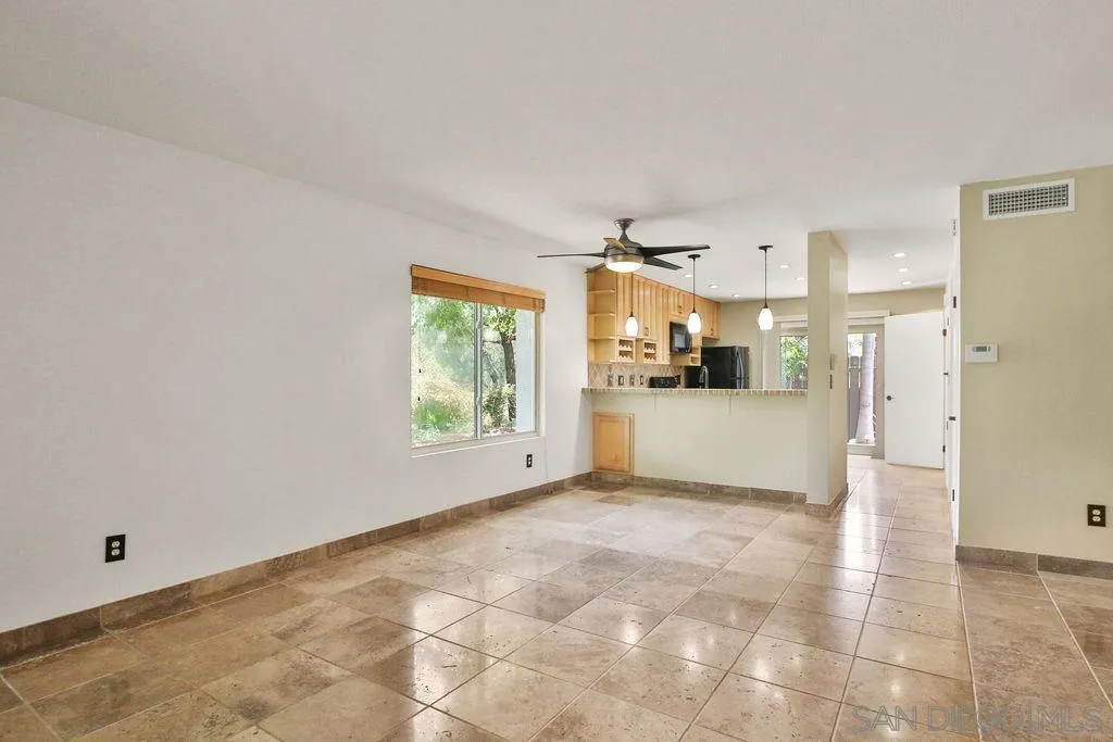 6359 Rancho Mission Road, Unit 7 San Diego, CA 92108 - Photo 4 of 25 a view of a kitchen with a sink and a window