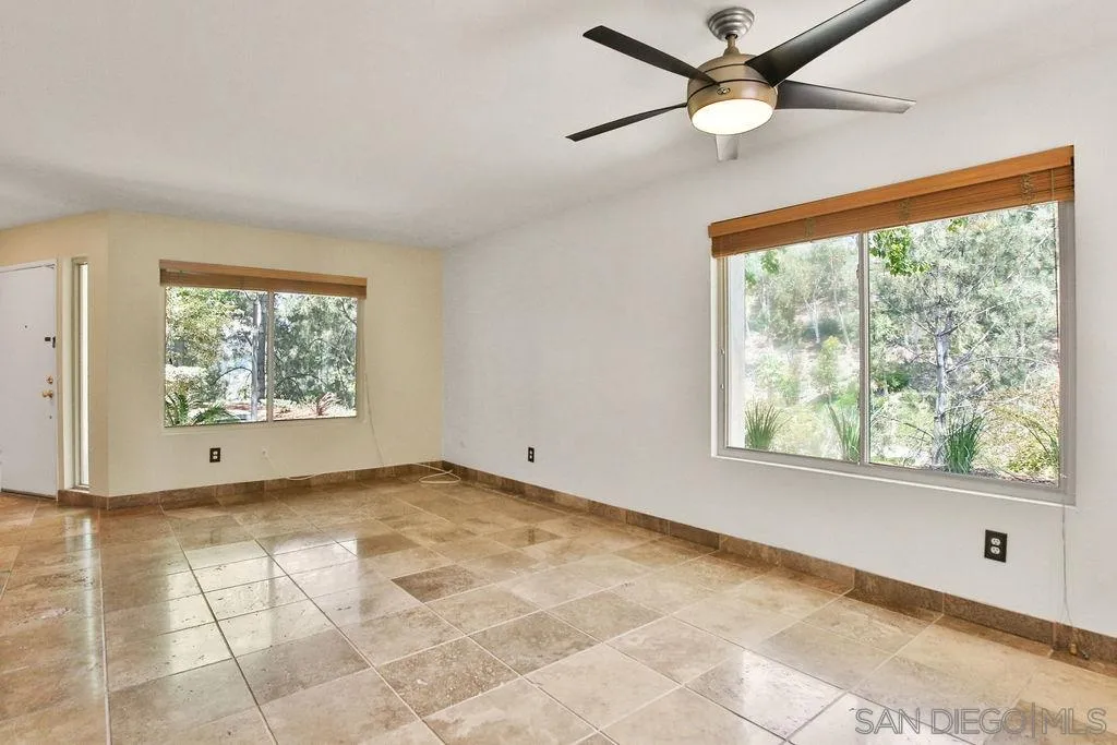 6359 Rancho Mission Road, Unit 7 San Diego, CA 92108 - Photo 5 of 25 an empty room with windows