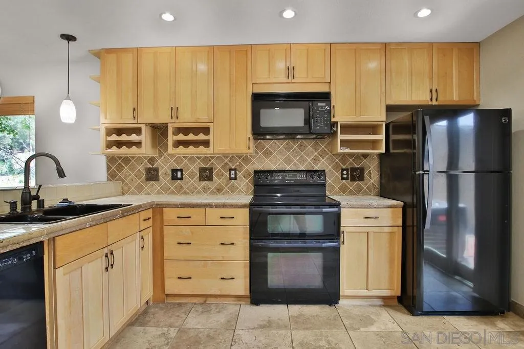 6359 Rancho Mission Road, Unit 7 San Diego, CA 92108 - Photo 7 of 25 a kitchen with a sink stove and refrigerator
