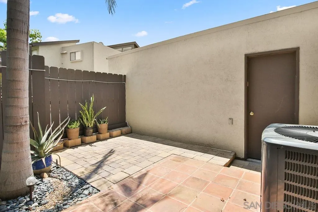 6359 Rancho Mission Road, Unit 7 San Diego, CA 92108 - Photo 9 of 25 a bed room with a bed