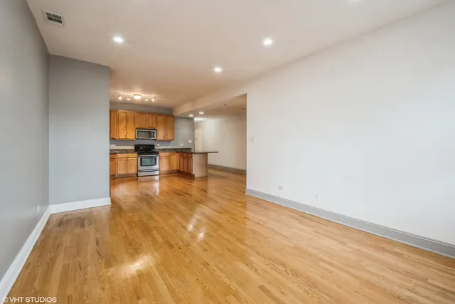 a view of kitchen and dining room with wooden floor