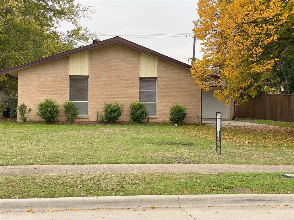 a house that has a tree in front of it