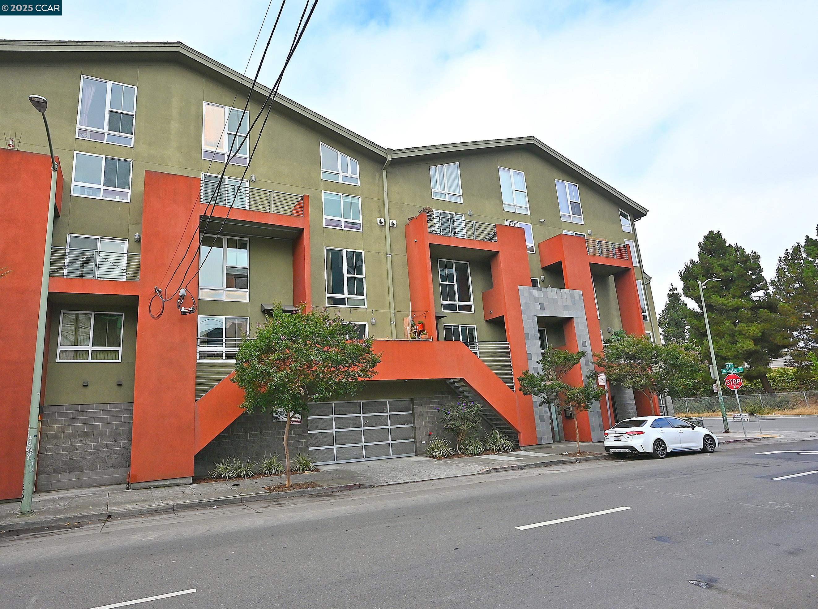 675 8th Street, Unit 15 Oakland, CA 94607 - Photo 2 of 38 a front view of a house with street