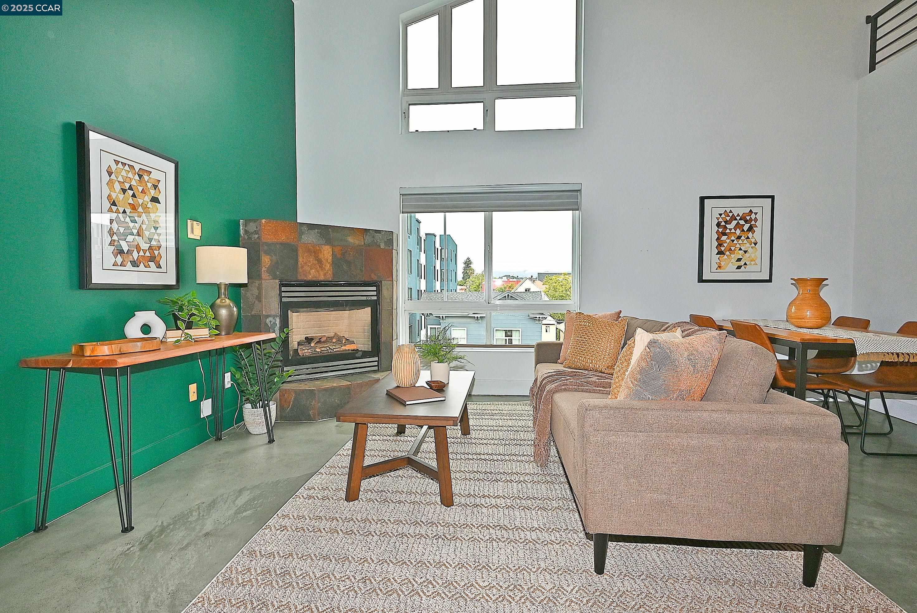 675 8th Street, Unit 15 Oakland, CA 94607 - Photo 6 of 38 a living room with furniture and a window
