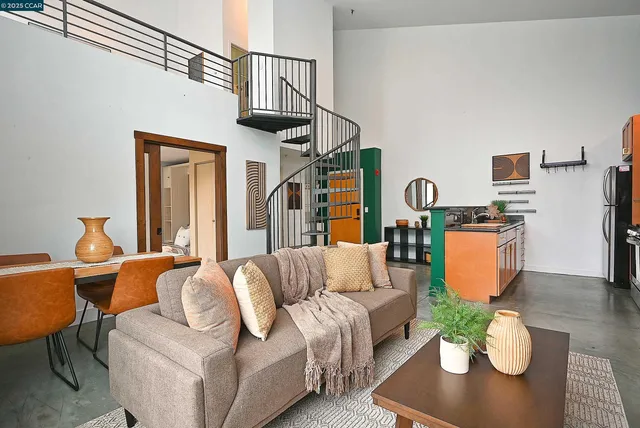 a living room with furniture a rug and a lamp