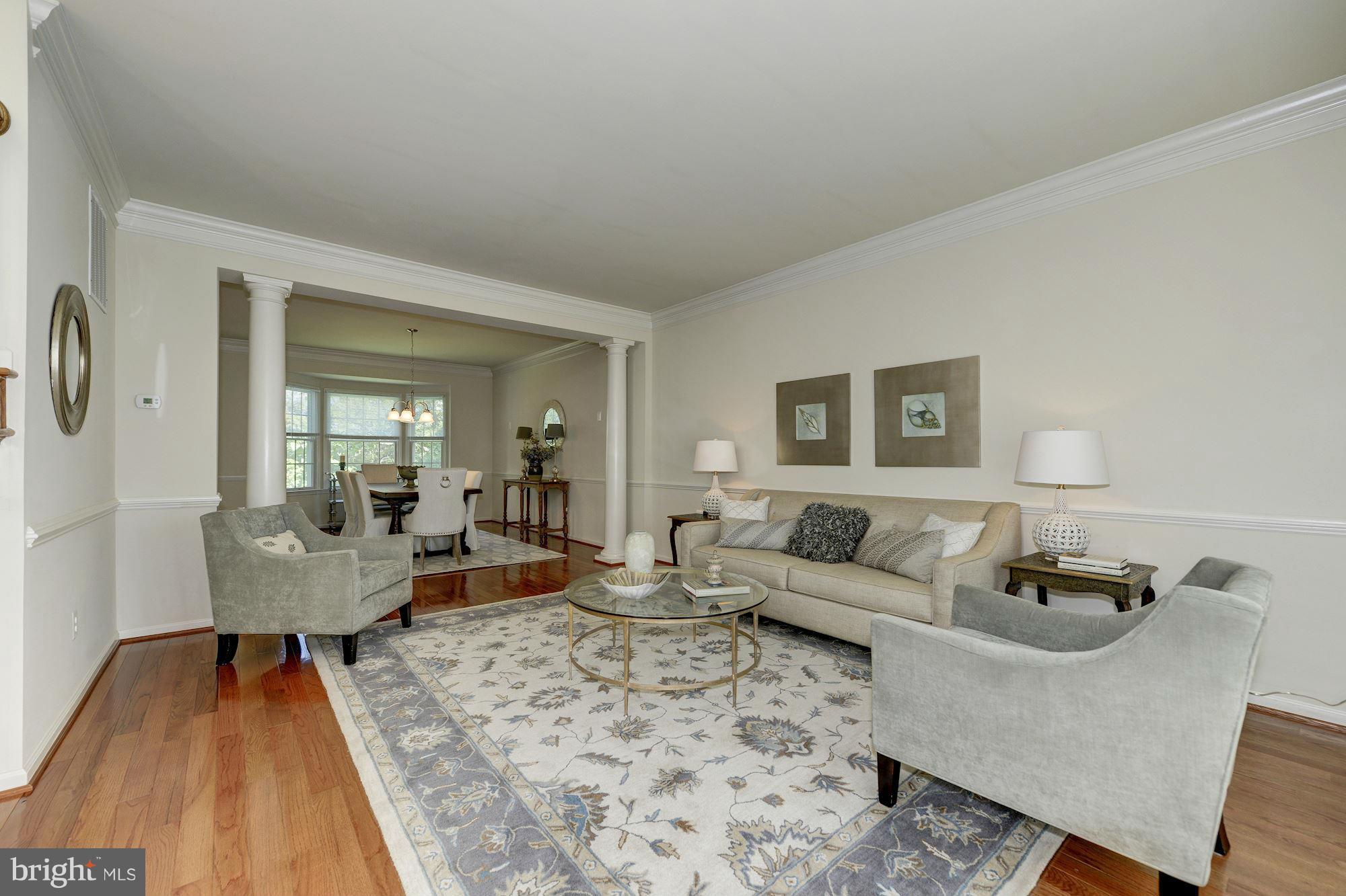 1357 Tunwell Stable Court Reston, VA 20194 - Photo 3 of 27 Living Room w/ wainscoting and hardwoods
