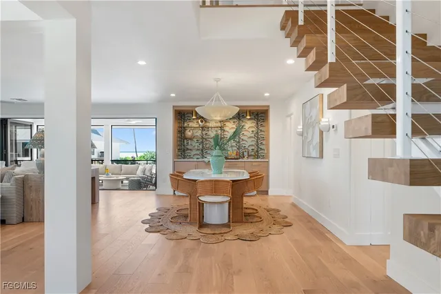 a living room with furniture window and wooden floor