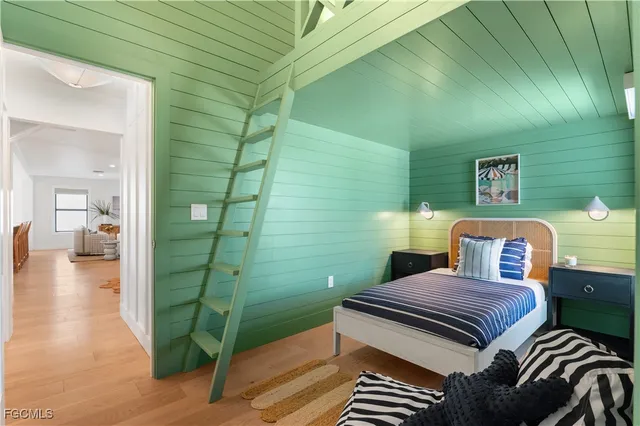 a bathroom with a toilet a sink and a mirror