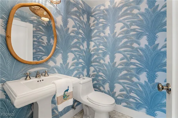 a bedroom with a bed and a night stand