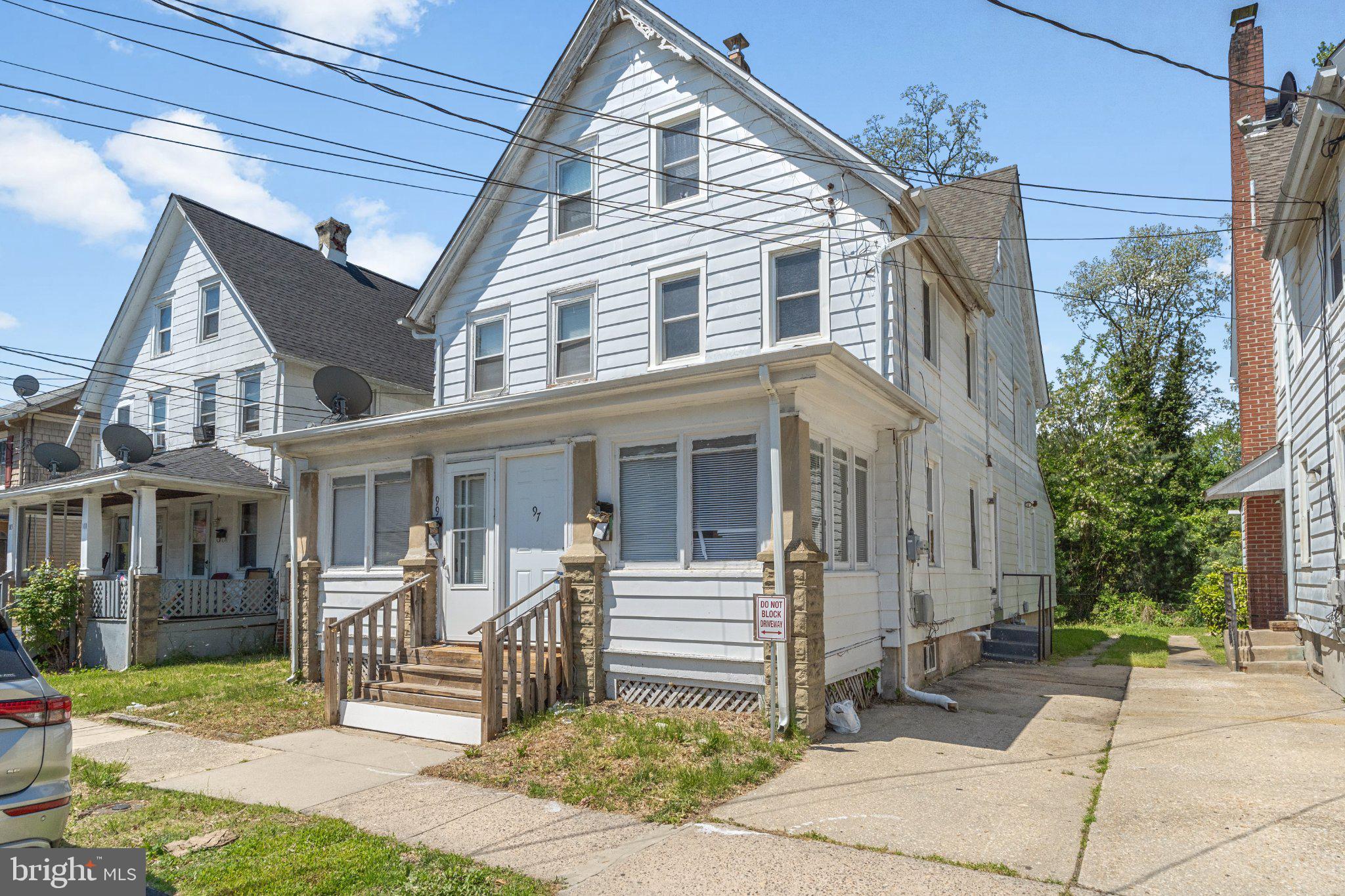 97 Chestnut Street Salem, NJ 08079 - Photo 1 of 38 a front view of a house with a yard