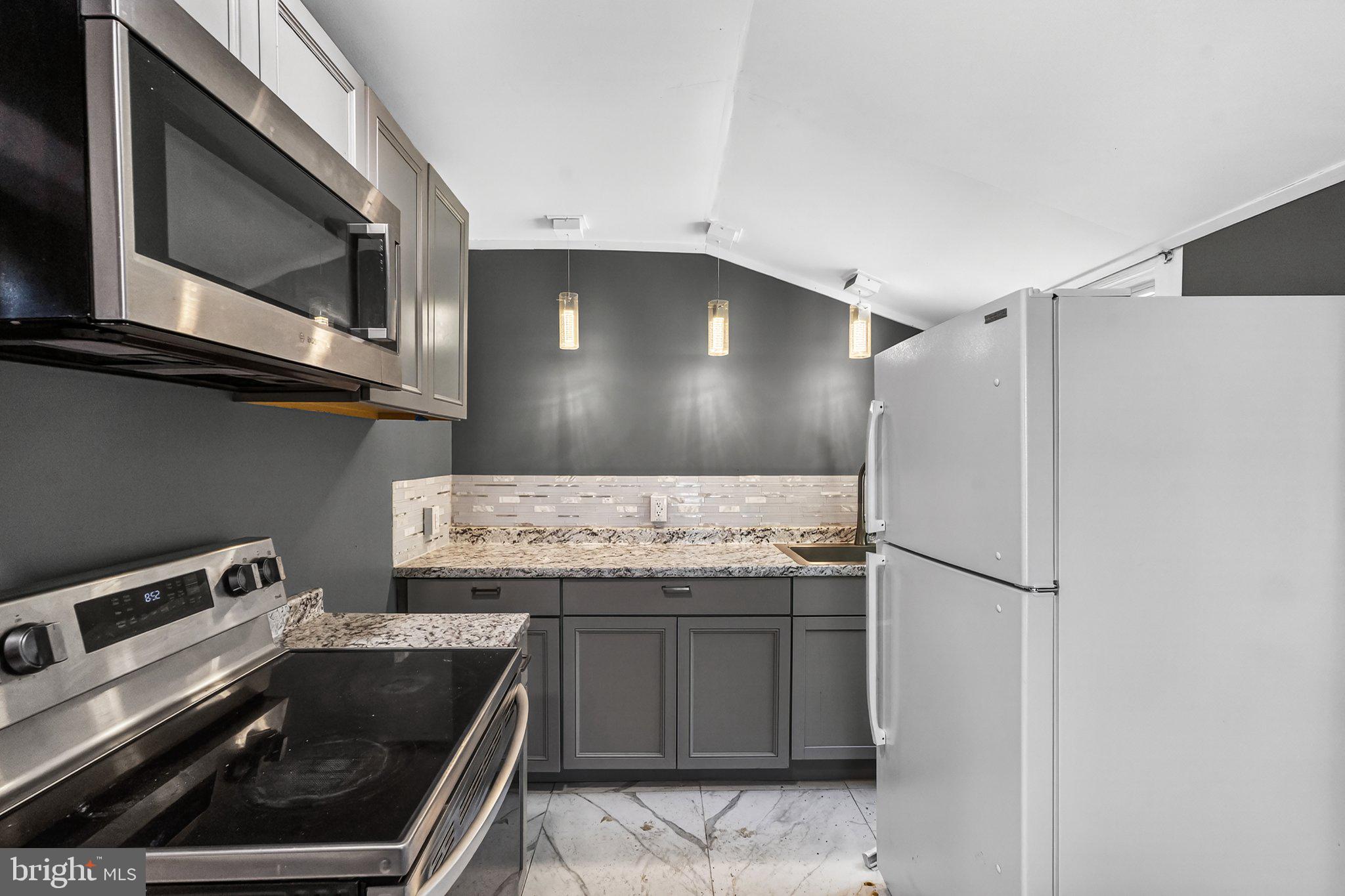 97 Chestnut Street Salem, NJ 08079 - Photo 11 of 38 a kitchen with a sink and stainless steel appliances