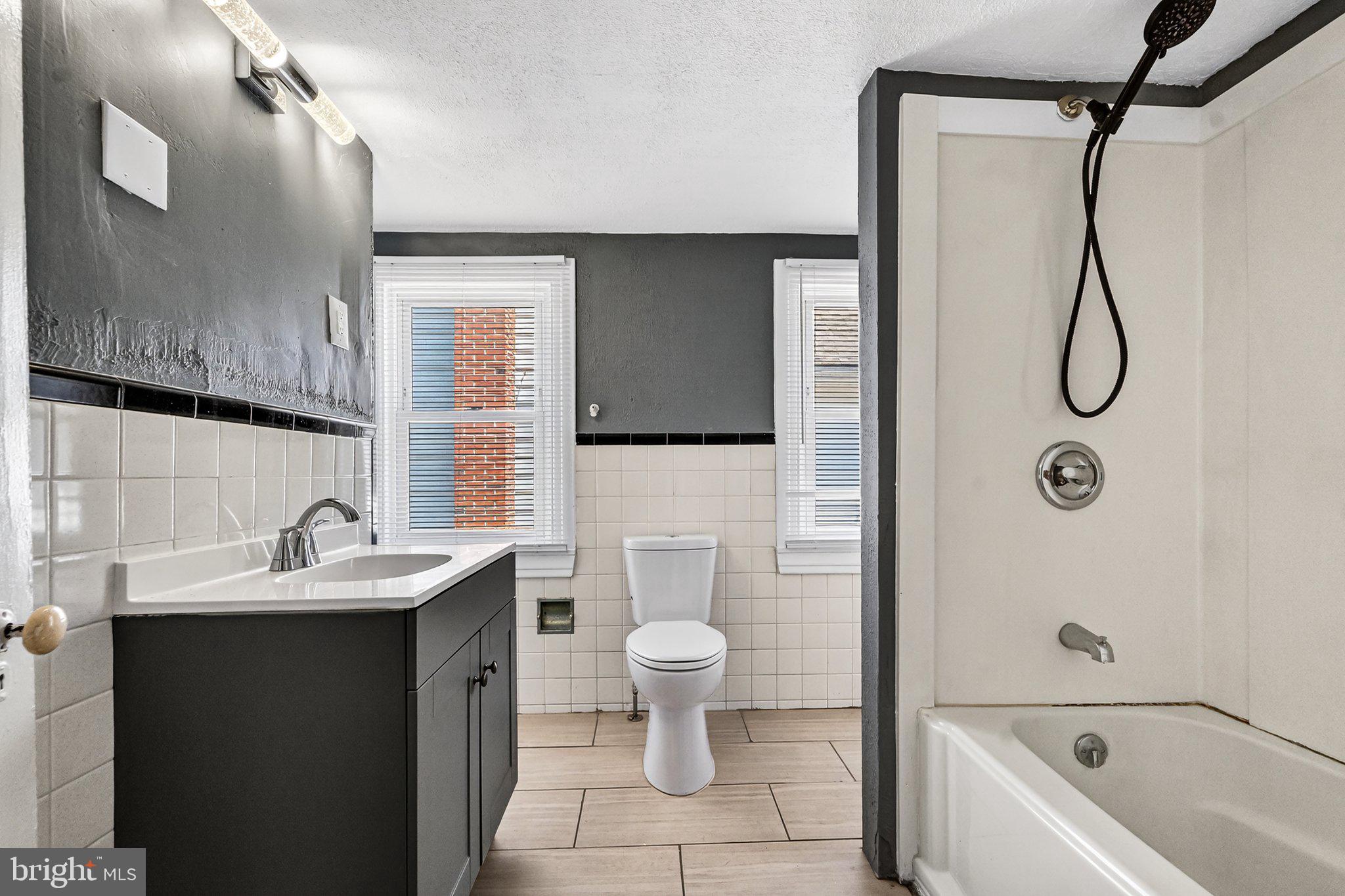 97 Chestnut Street Salem, NJ 08079 - Photo 20 of 38 a bathroom with a sink toilet and shower