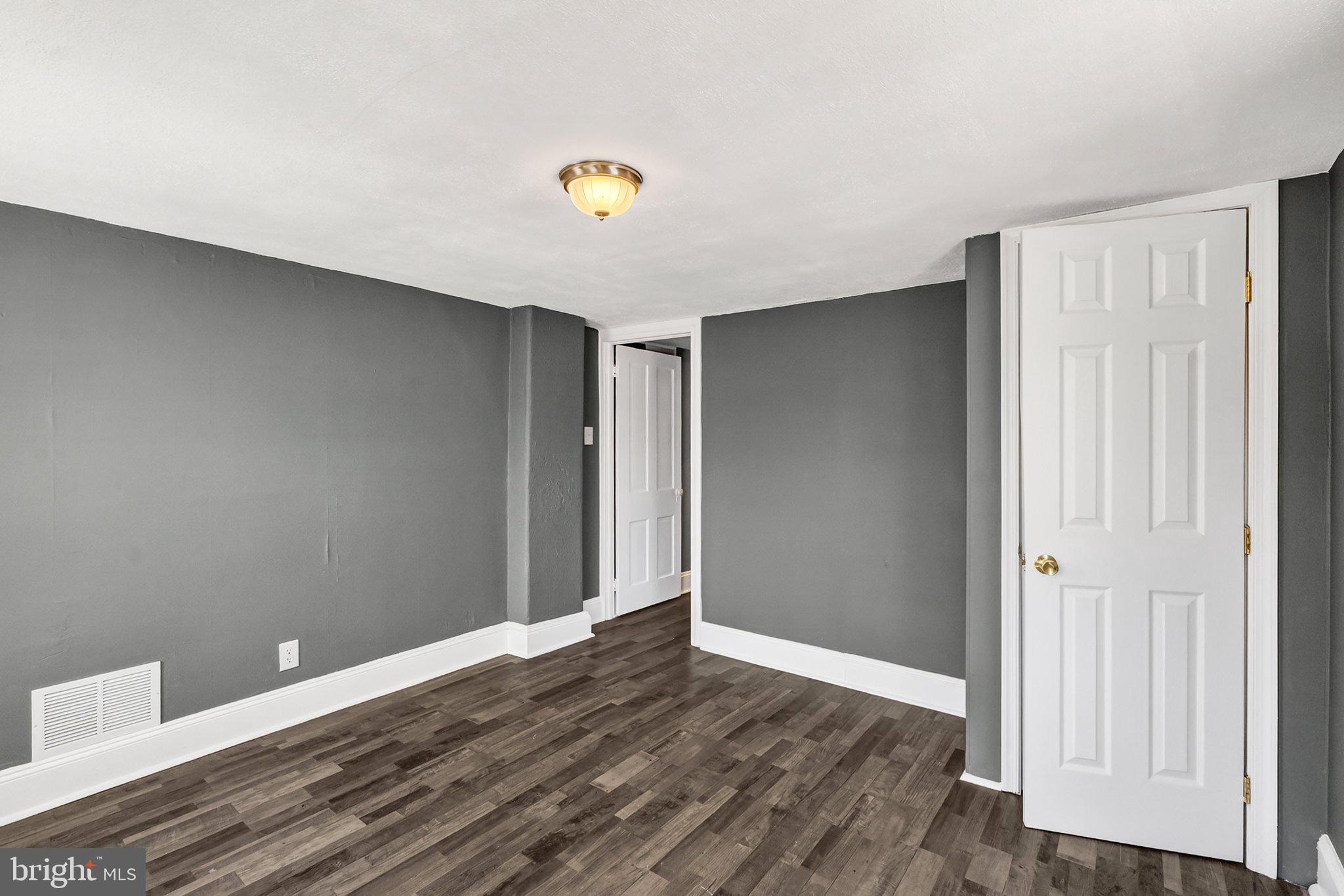 97 Chestnut Street Salem, NJ 08079 - Photo 22 of 38 a view of an empty room with wooden floor