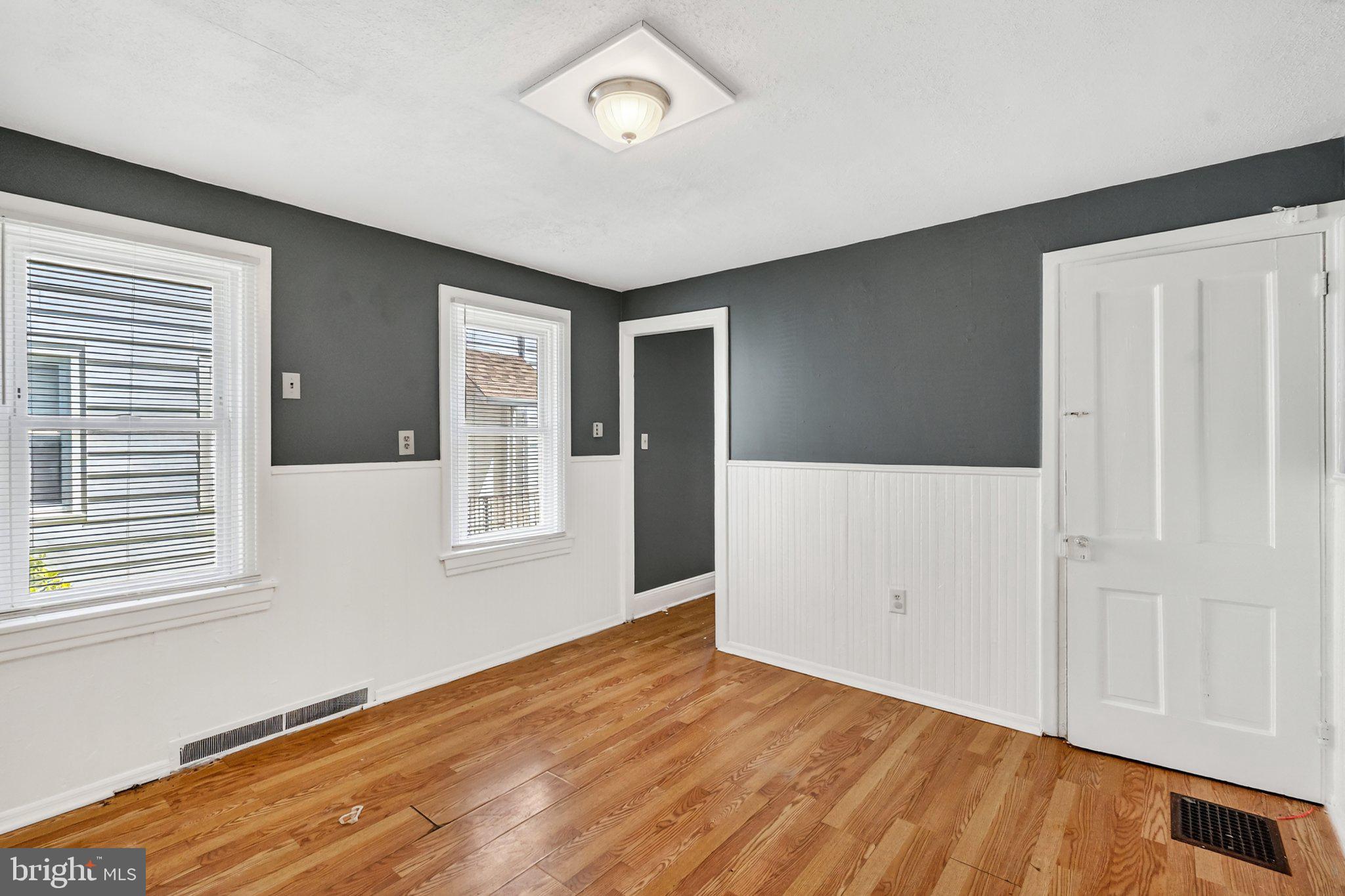 97 Chestnut Street Salem, NJ 08079 - Photo 9 of 38 a view of an empty room with wooden floor and a window