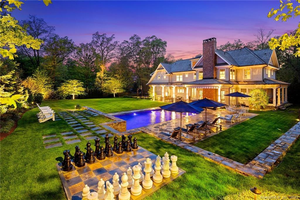 4 Salem Road Westport, CT 06880 - Photo 1 of 1 a view of a swimming pool with an outdoor seating