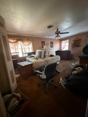 a living room with furniture and a window