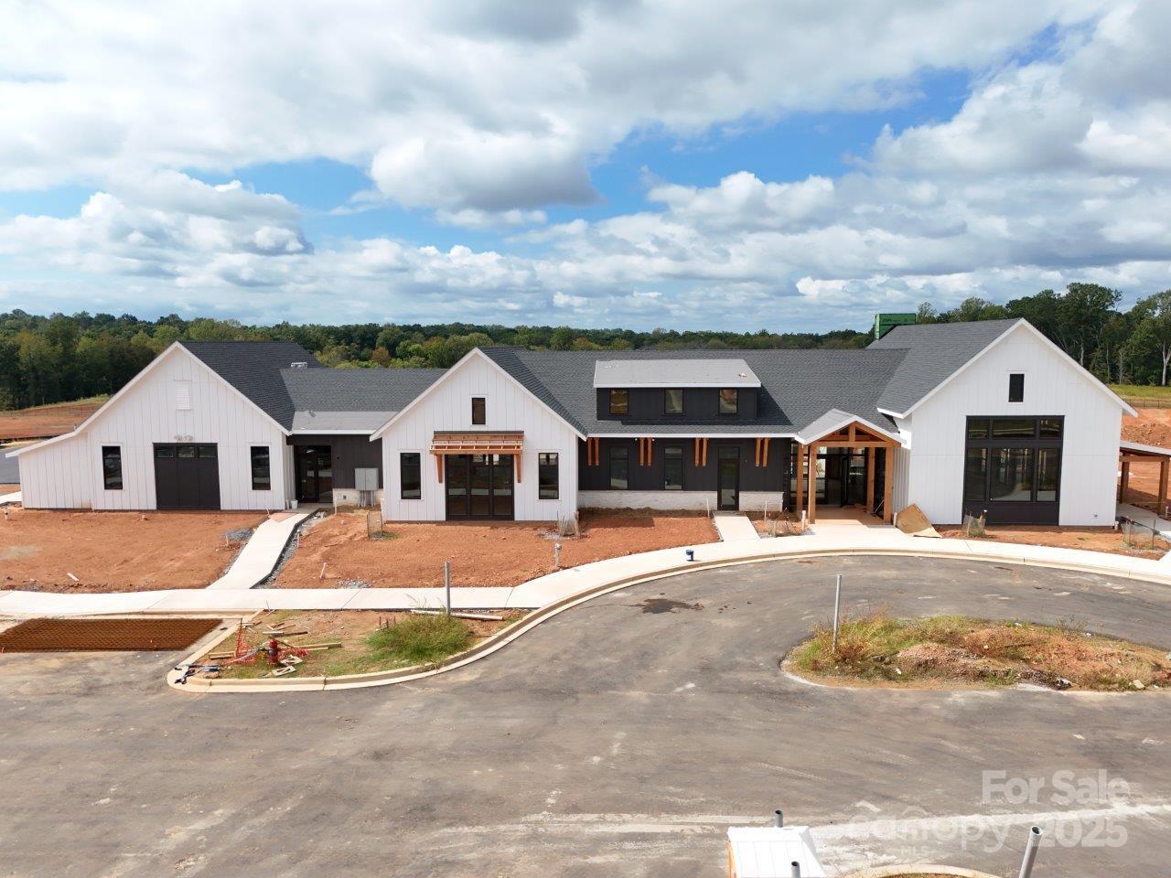 1081 Pinecone Avenue, Unit 213 Indian Land, SC 29707 - Photo 9 of 19 a front view of a house with a yard