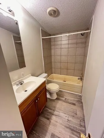 a bathroom with a double vanity sink mirror and toilet