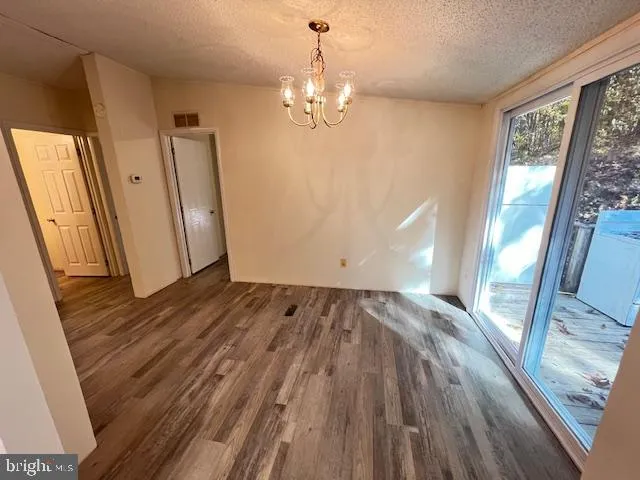 a view of livingroom with kitchen and fireplace