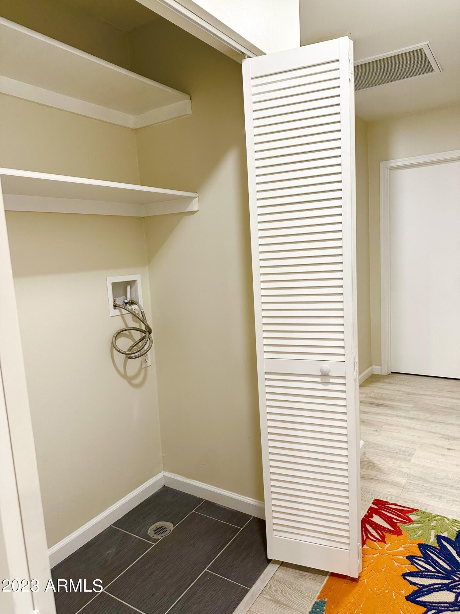 2547 West Adams Street Phoenix, AZ 85009 - Photo 18 of 42 Laundry with overflow drain