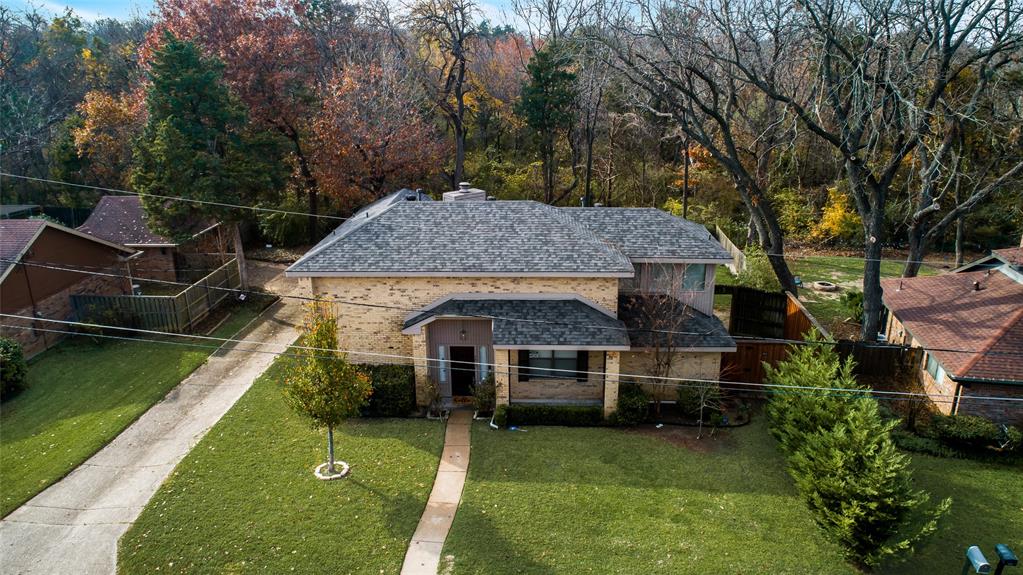 4812 Hollow Ridge Road Dallas, TX 75227 - Photo 1 of 1 a front view of a house with garden