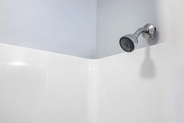 a view of a livingroom with wooden floor and stairs