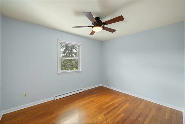 a stone fireplace with a wooden floor