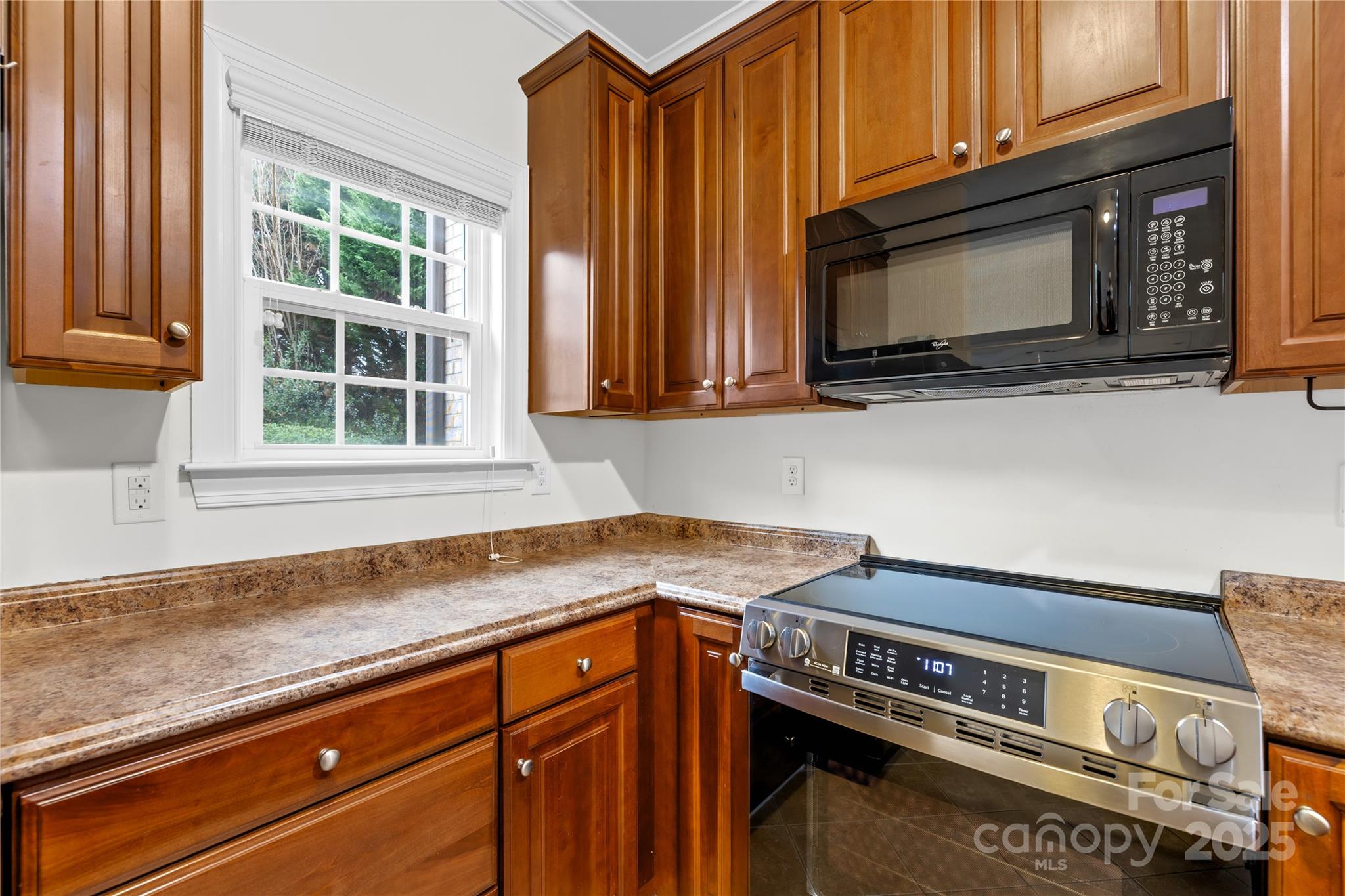 518 Armour Street Davidson, NC 28036 - Photo 11 of 26 a kitchen with a stove microwave and sink