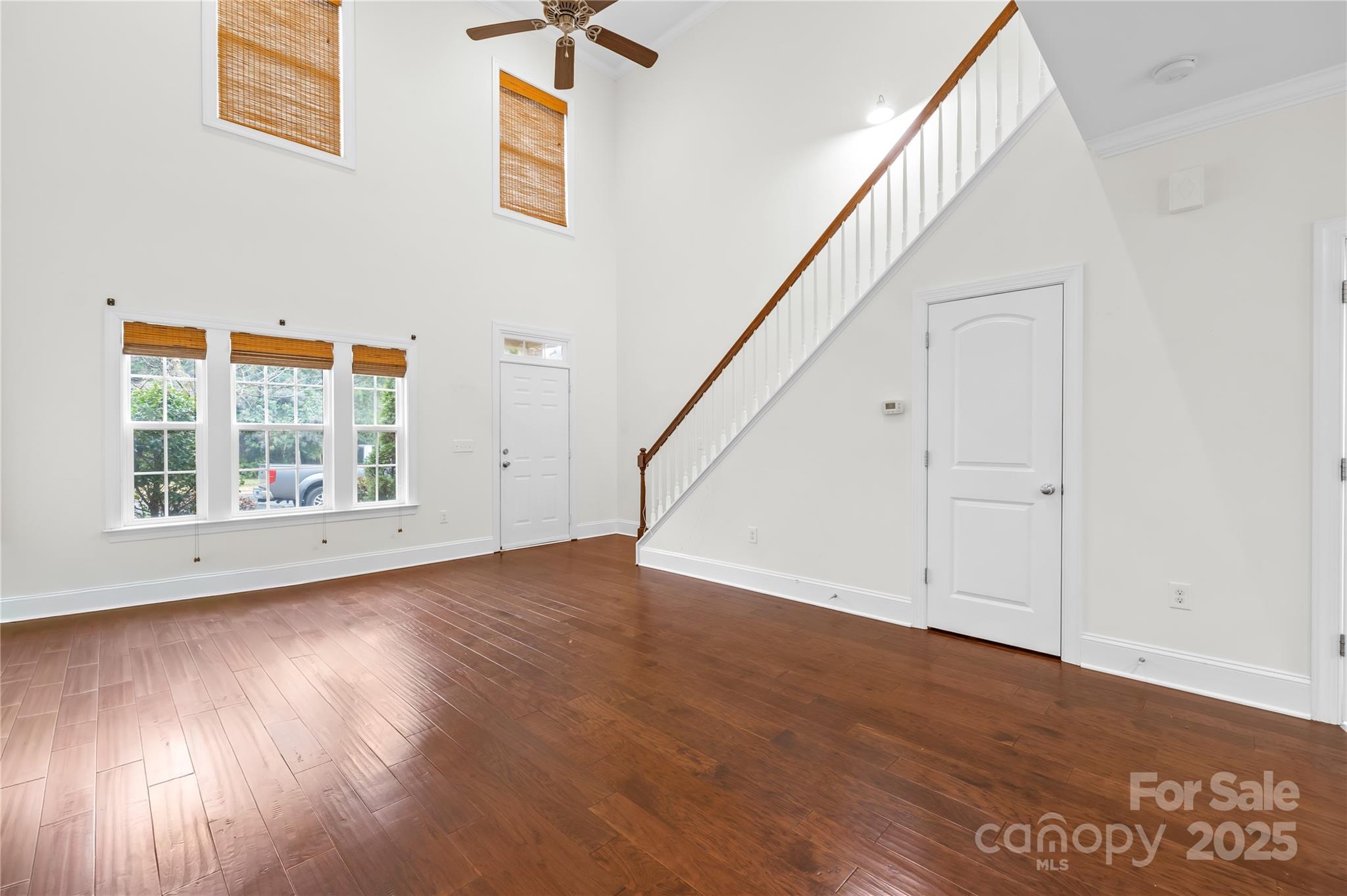 518 Armour Street Davidson, NC 28036 - Photo 13 of 26 an empty room with wooden floor and windows