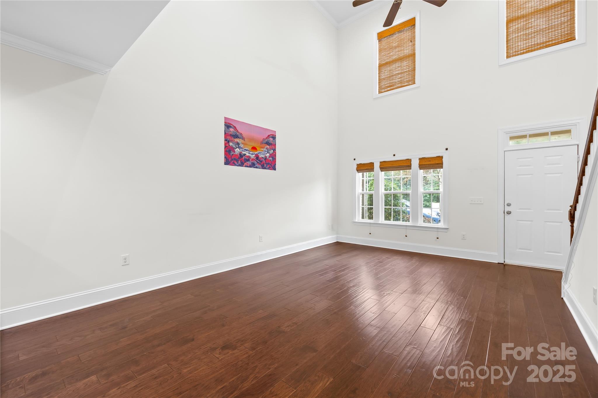 518 Armour Street Davidson, NC 28036 - Photo 15 of 26 an empty room with wooden floor and windows
