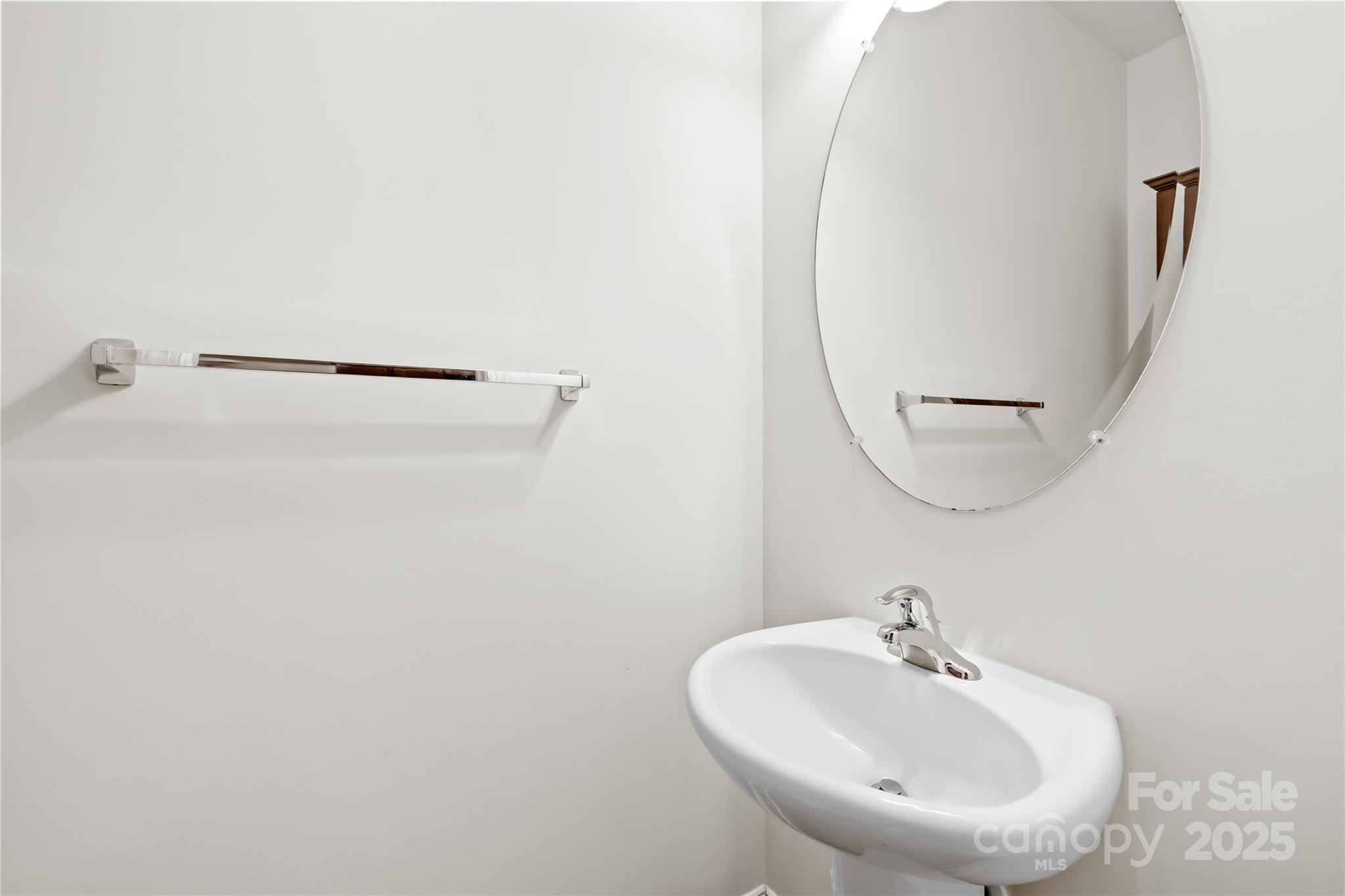 518 Armour Street Davidson, NC 28036 - Photo 16 of 26 a bathroom with a sink and a mirror