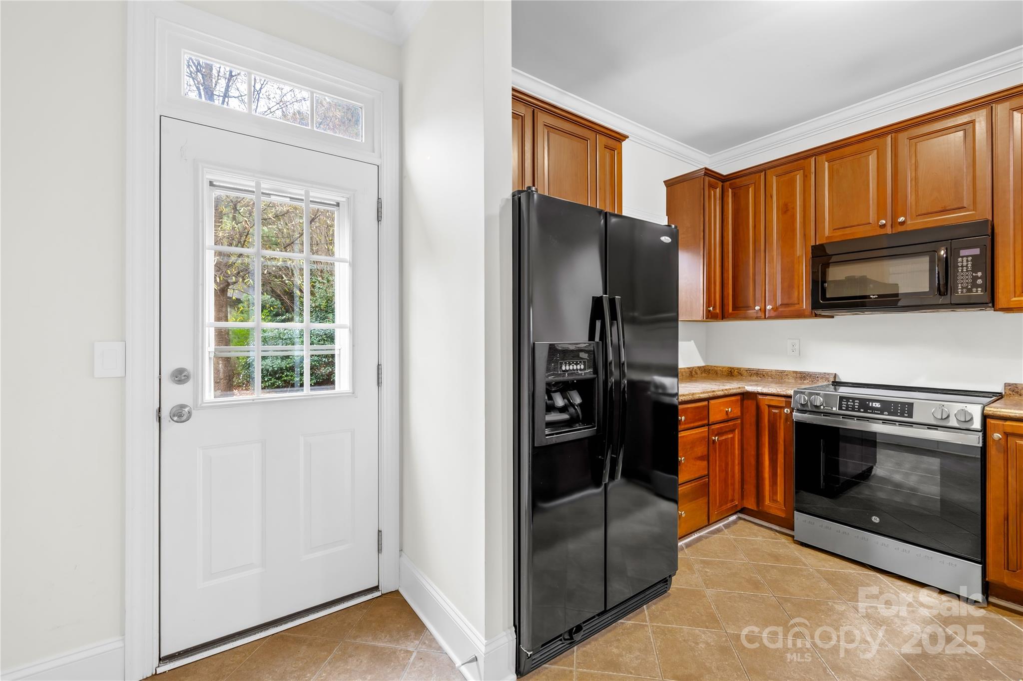 518 Armour Street Davidson, NC 28036 - Photo 18 of 26 a kitchen with stainless steel appliances granite countertop a refrigerator stove and sink