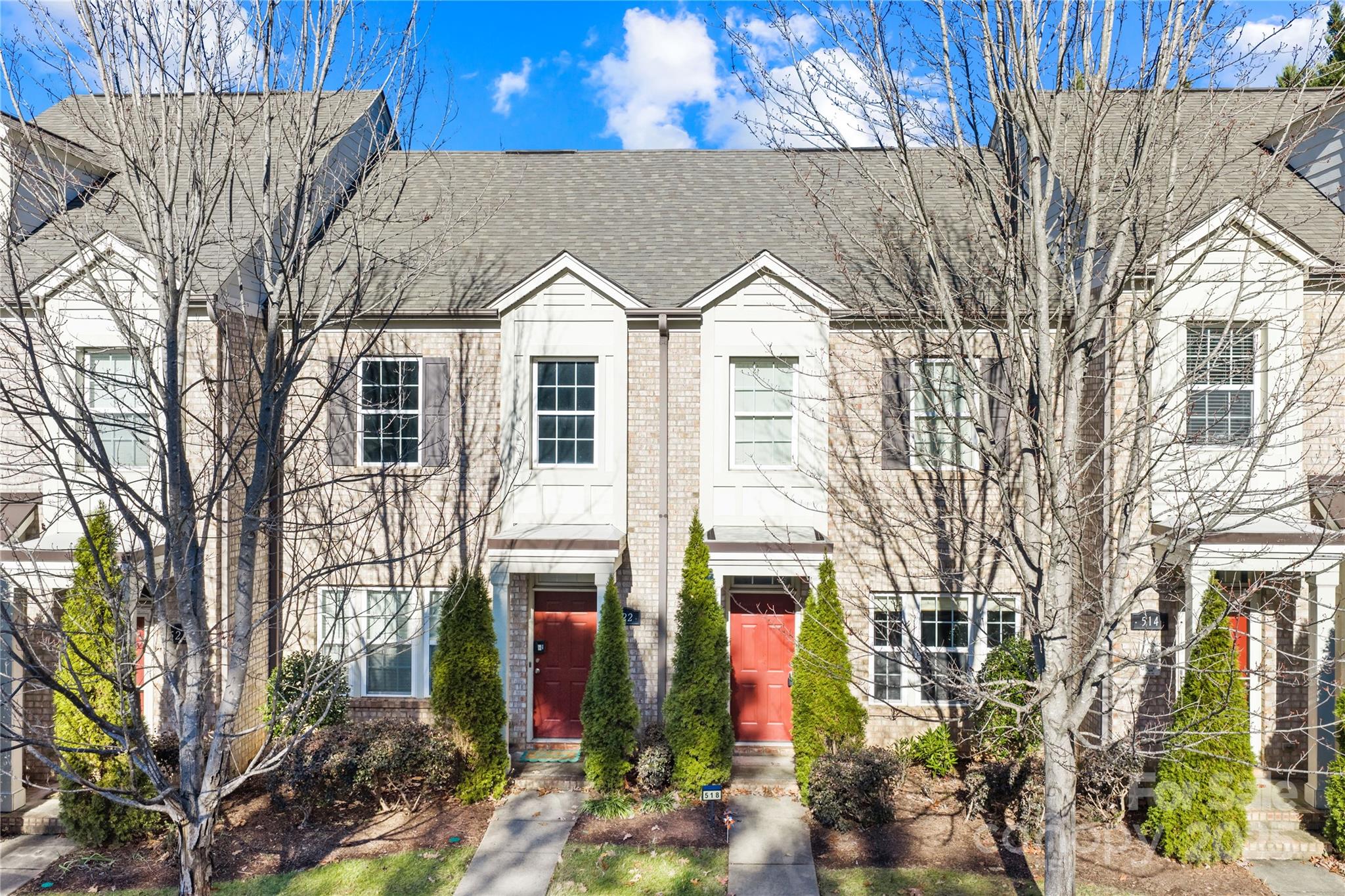 518 Armour Street Davidson, NC 28036 - Photo 26 of 26 a view of a white house with large windows and a tree