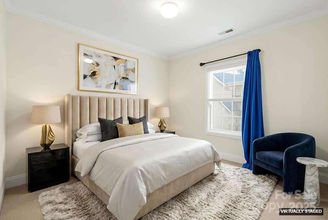 518 Armour Street Davidson, NC 28036 - Photo 4 of 26 a bedroom with bed and a painting on the wall